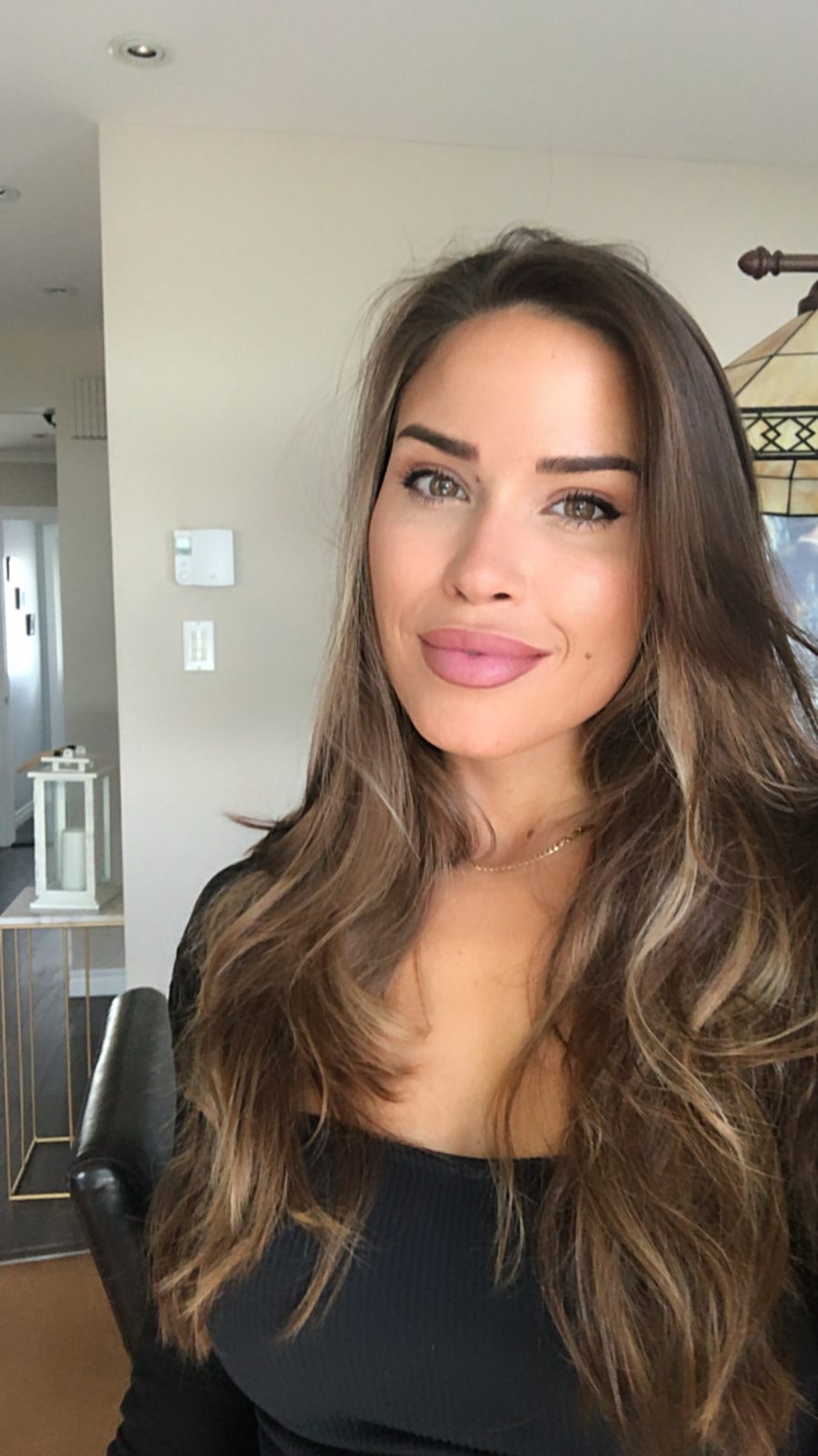 Jade, medical esthetician and founder of Jadeelle Beauté, with naturally glowing skin